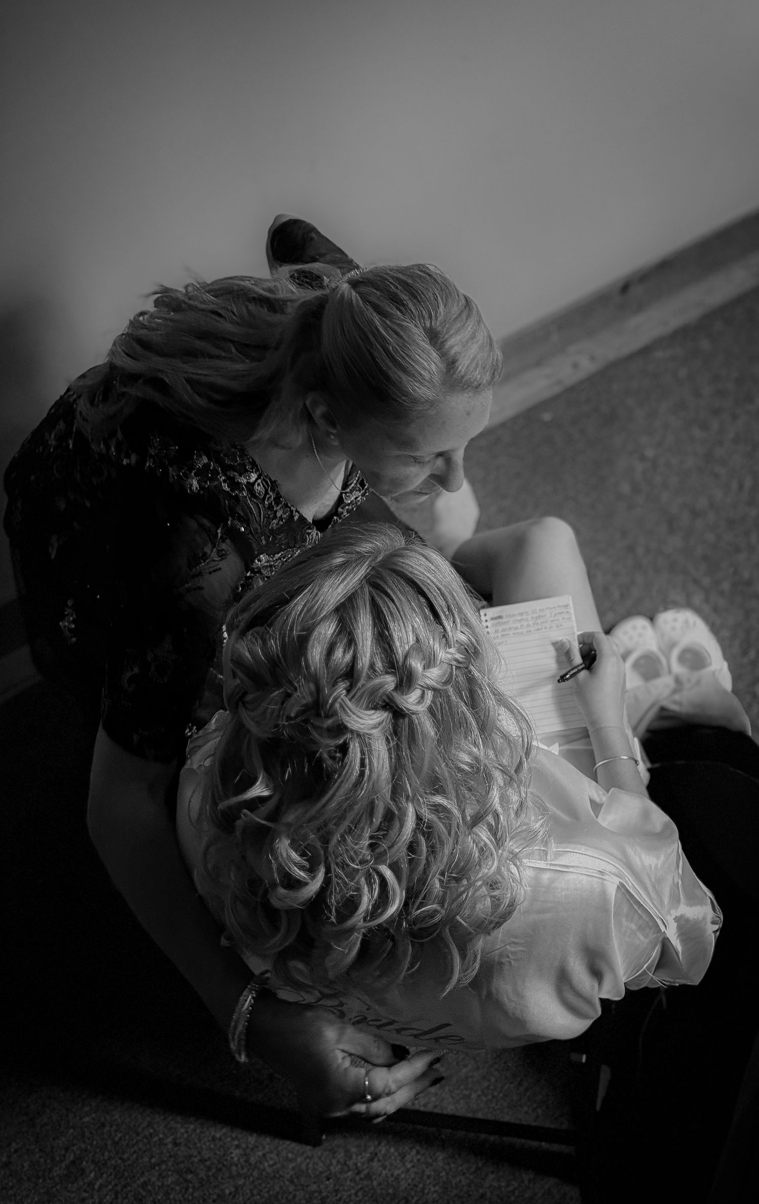 Black and white photo showing intimate mother and daughter moment