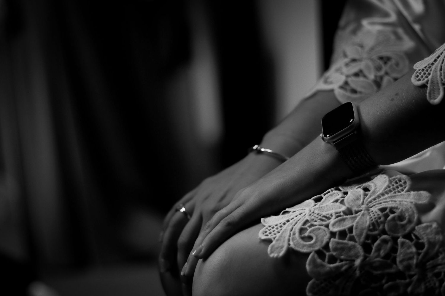 Close-up details of hands and gestures in dramatic black and white photography.