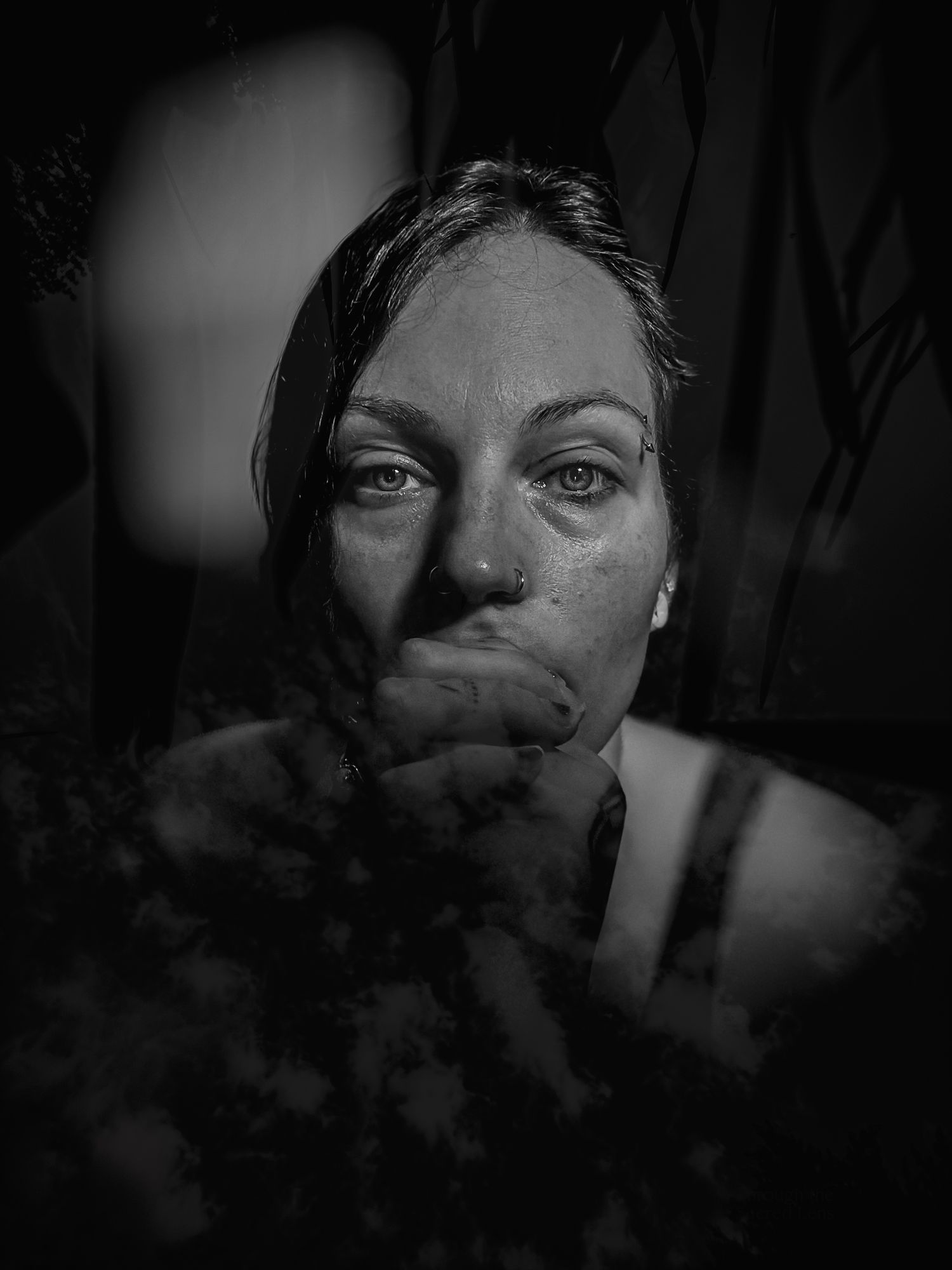 Dramatic black and white portrait series with artistic shadows and lighting effects.