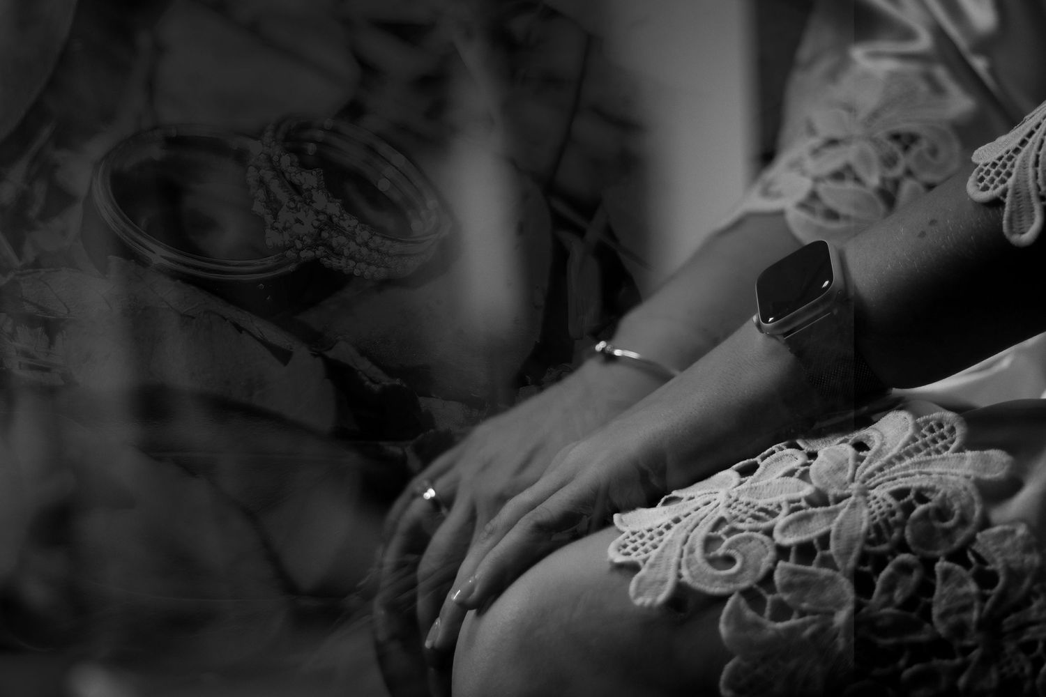 Intimate black and white photography showing hands and emotional moments.