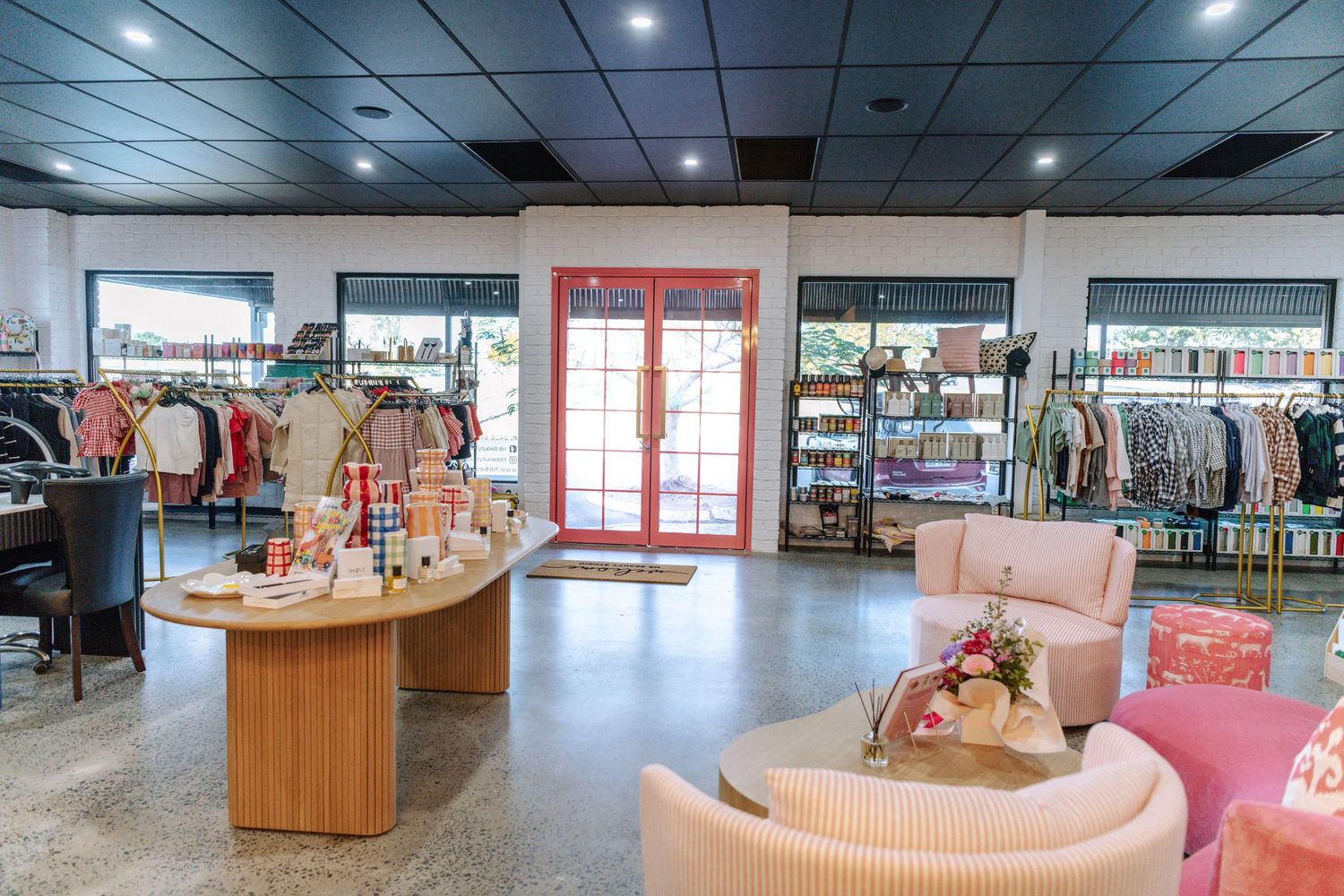 Modern retail store interior with bright lighting and open floor plan.