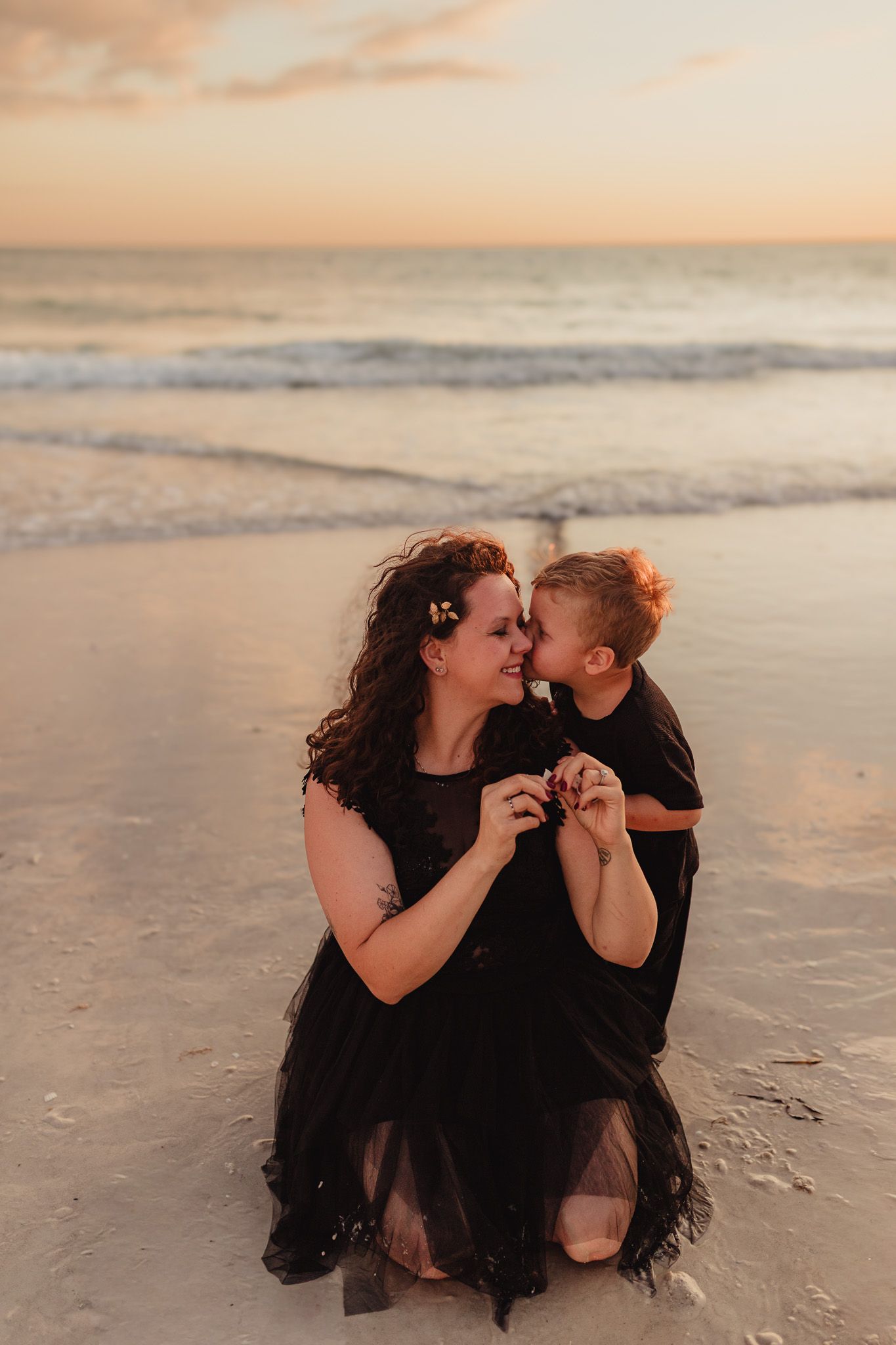 Sarasota family photography documenting authentic moments between parents and children during a golden hour session.
