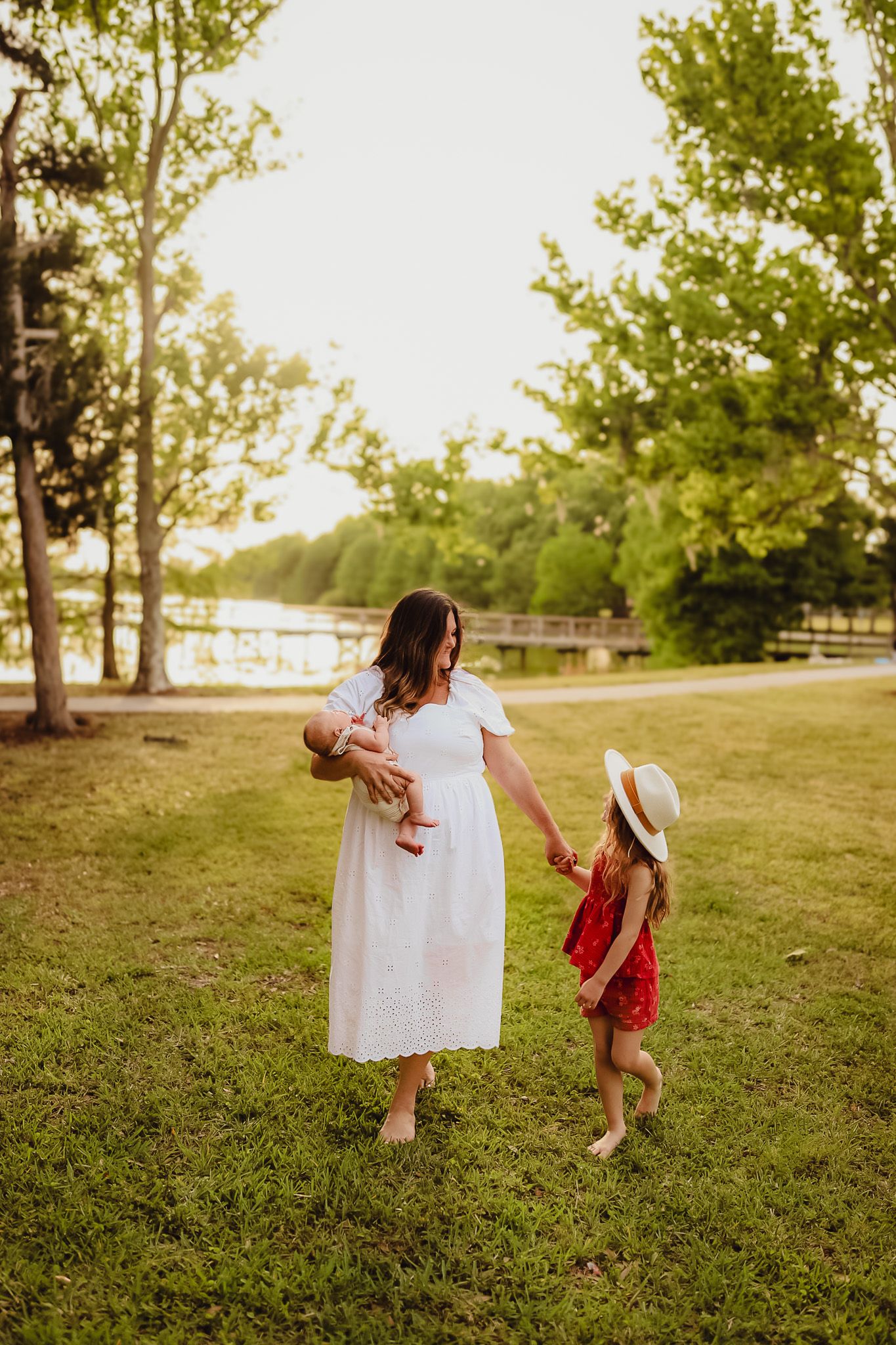 Sarasota family photography documenting authentic moments between parents and children during a golden hour session.