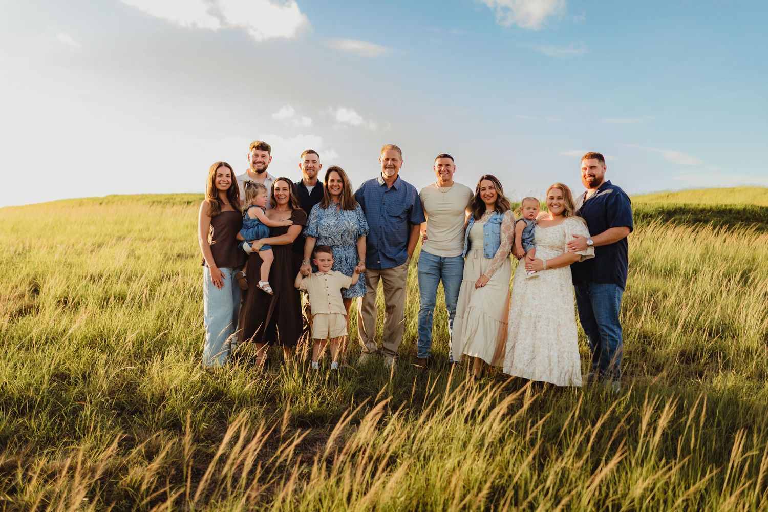 Bradenton extended family photography featuring multiple generations holding hands during a relaxed outdoor family session.