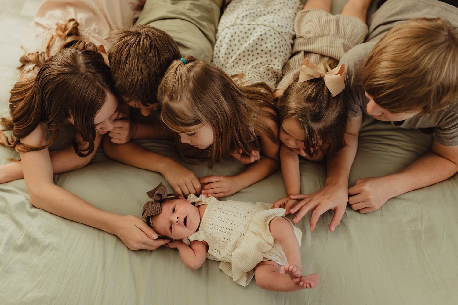 Lifestyle newborn photographer in Bradenton documenting a relaxed in-home newborn session with a growing family.