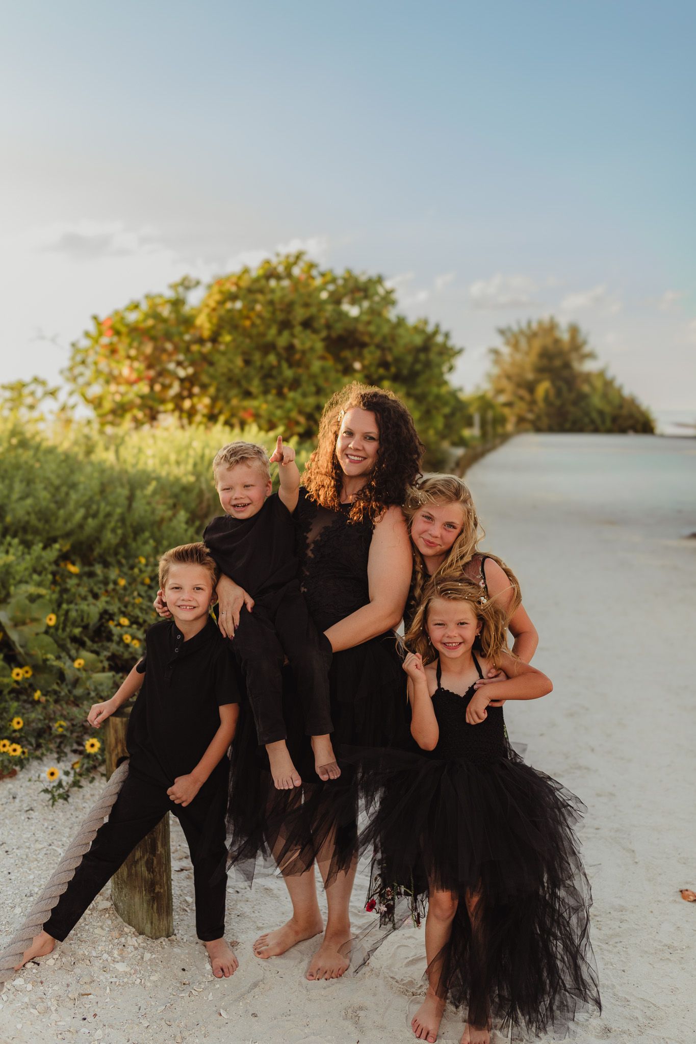 Anna Maria Island family photographer creating timeless beach portraits filled with genuine smiles and connection.