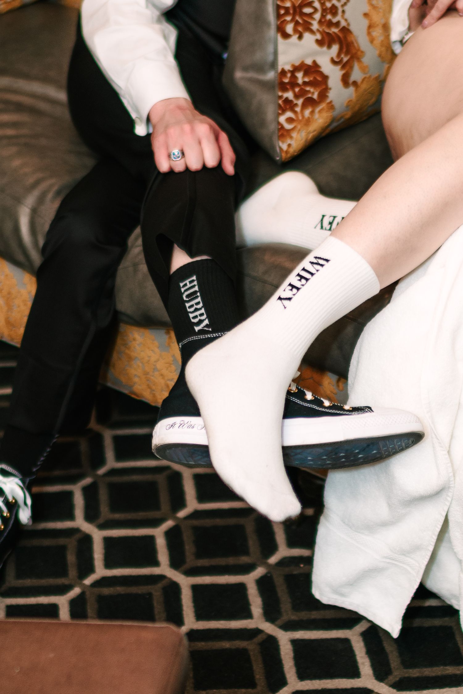Hotel DuPont wedding Philadelphia photographer Couple wearing matching Hubby and Wifey wedding socks on their special day.