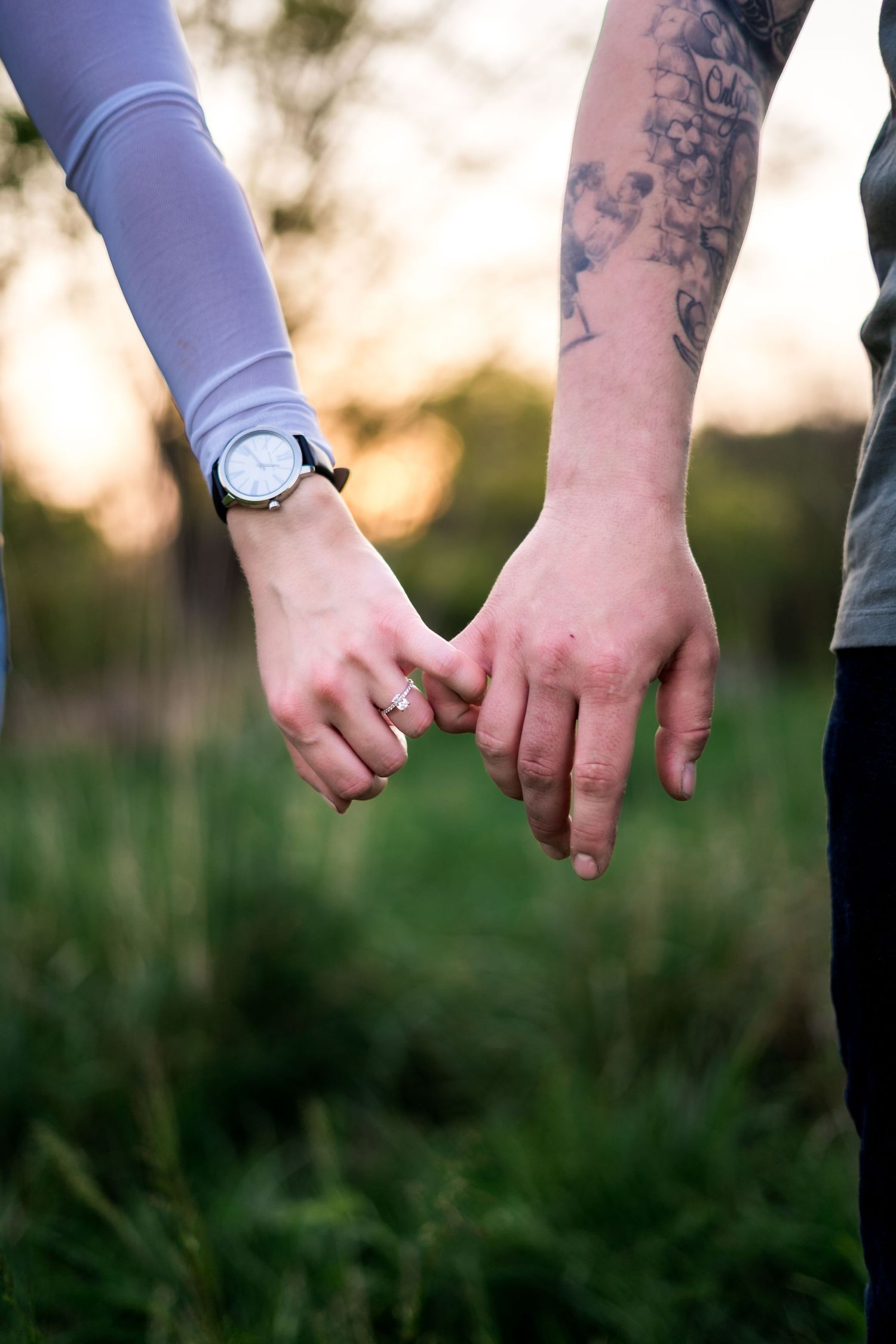 philadelphia wedding engagement photographer couple holding hands during golden hour