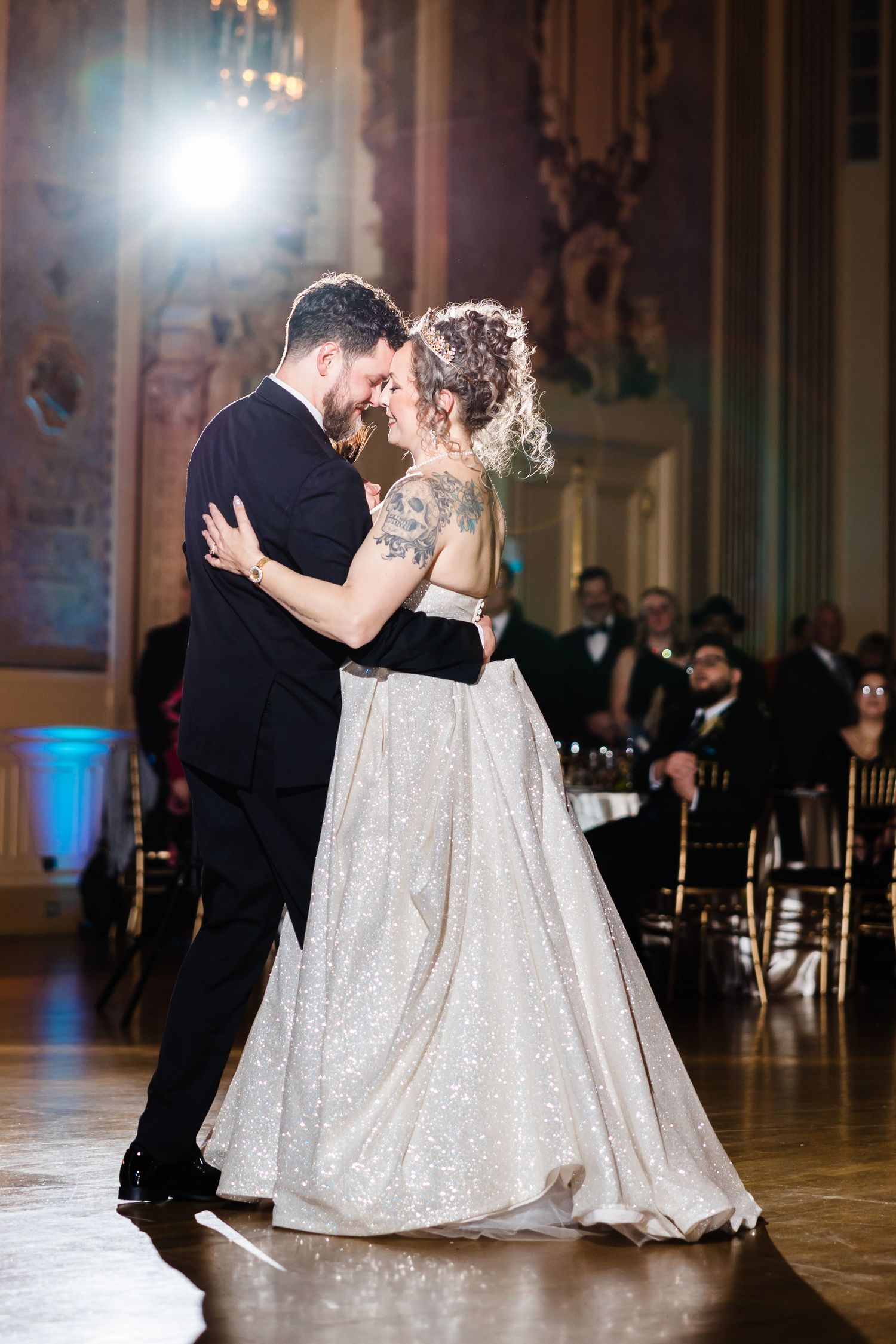 Hotel DuPont wedding Philadelphia photographer bride and groom share first dance in ornate ballroom with guests seated nearby.