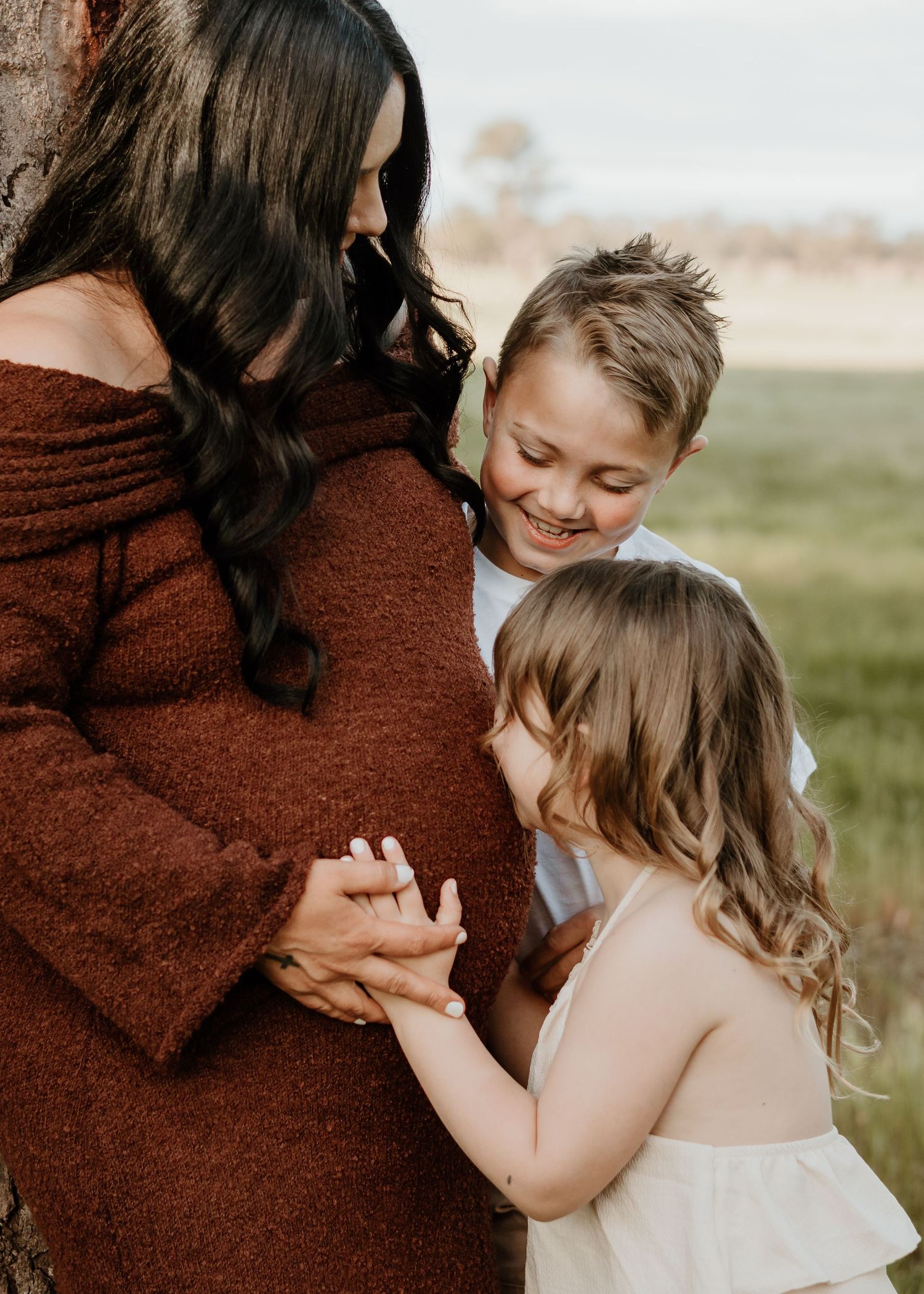 Family maternity golden hour photography with family capturing connection