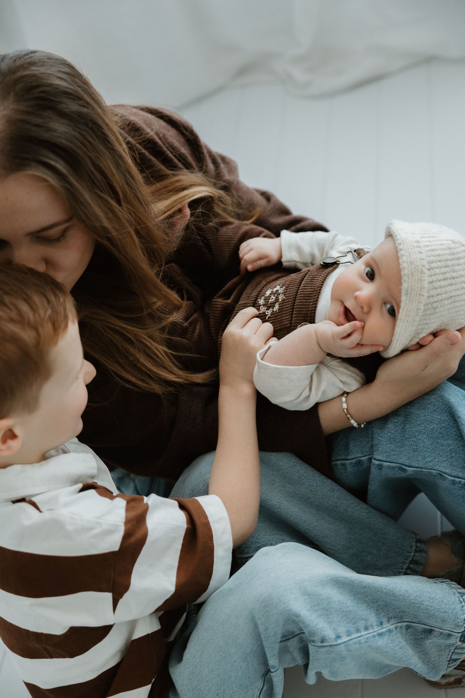 Natural family photography session capturing connection indoor studio Wagga Wagga