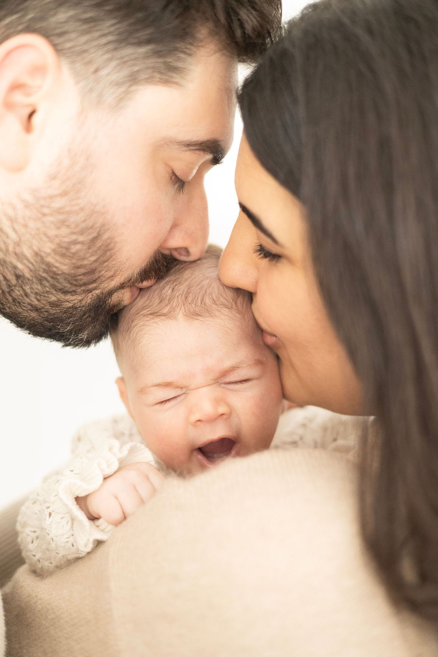 newborn home photography session western adelaide parents kissing baby