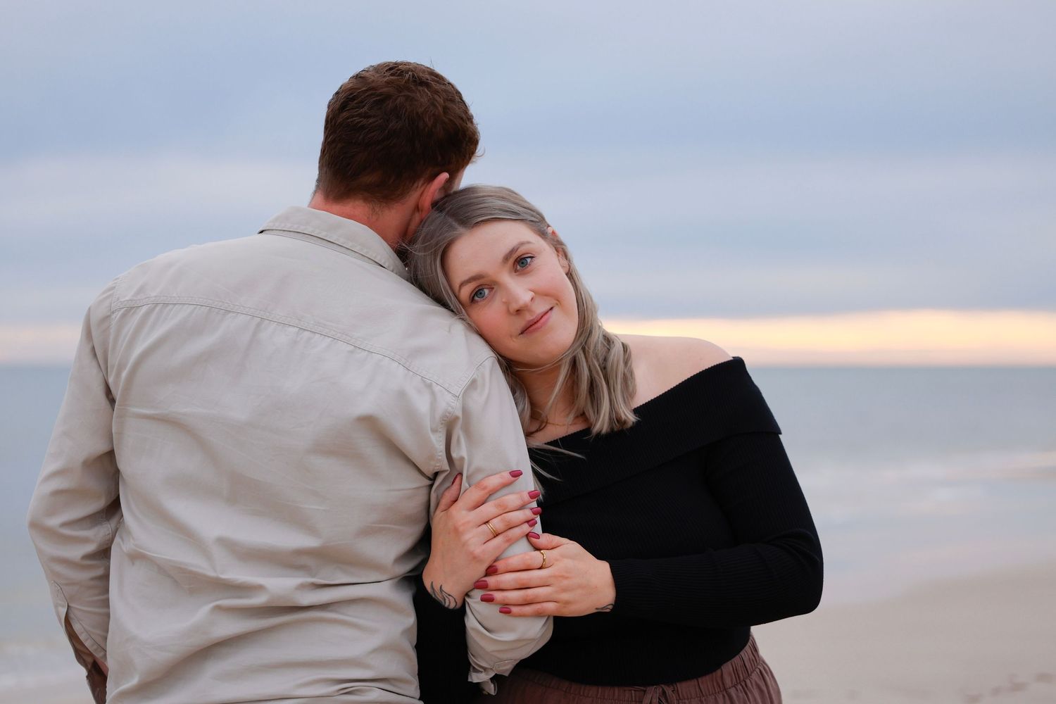 couple holding hands west beach adelaide