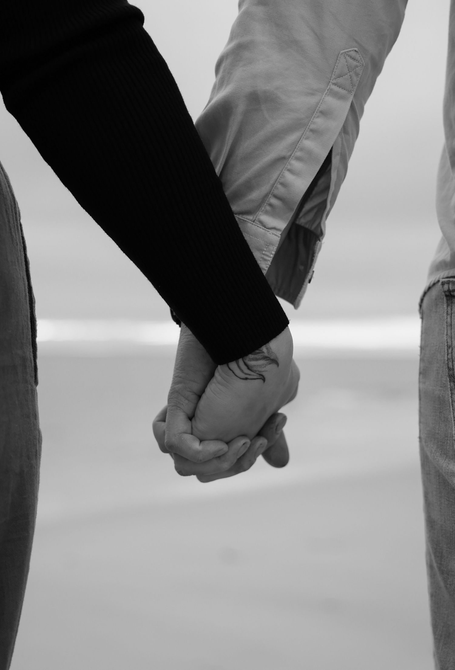 couple holding hands west beach adelaide
