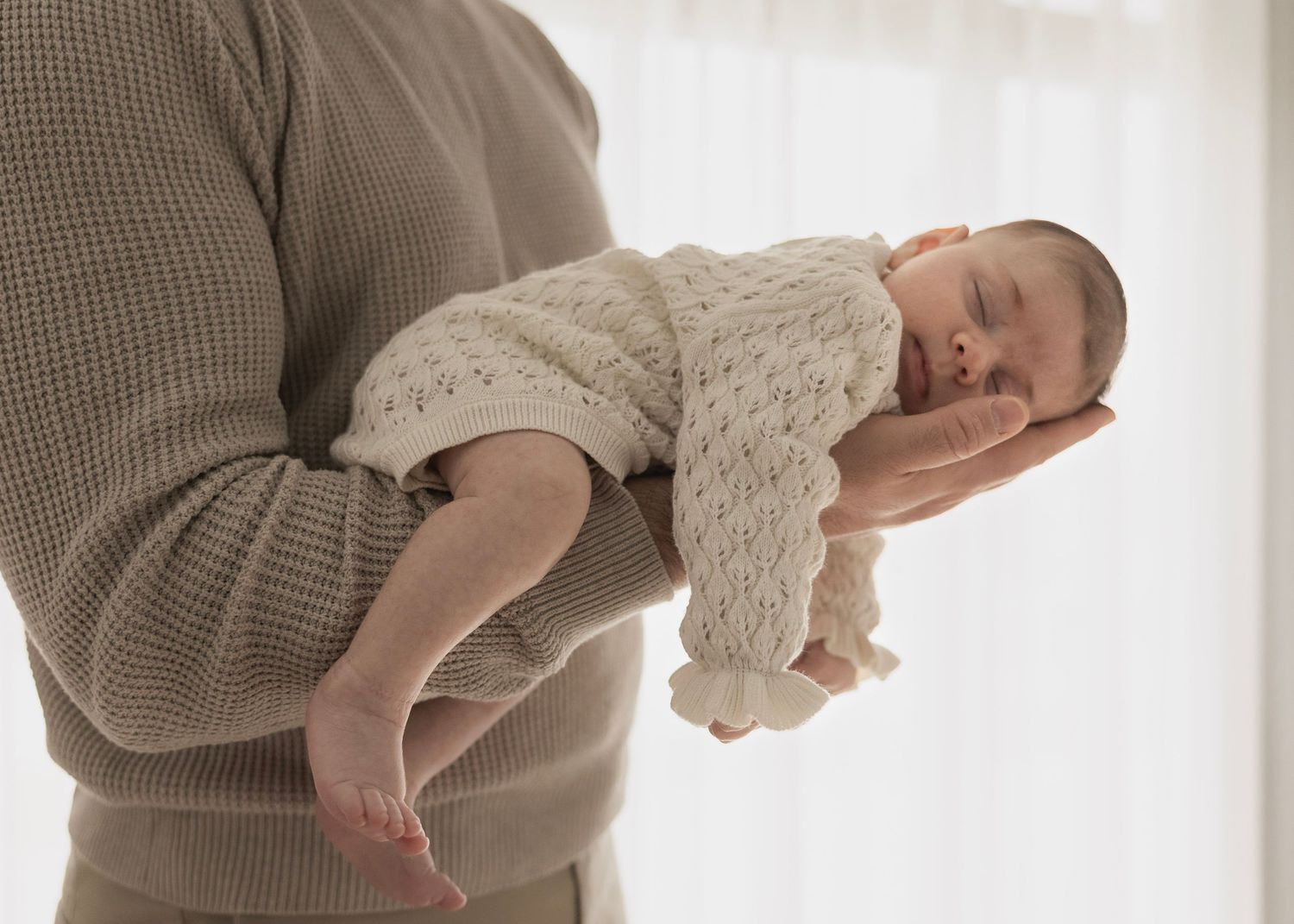 newborn home photography session western adelaide father holding baby