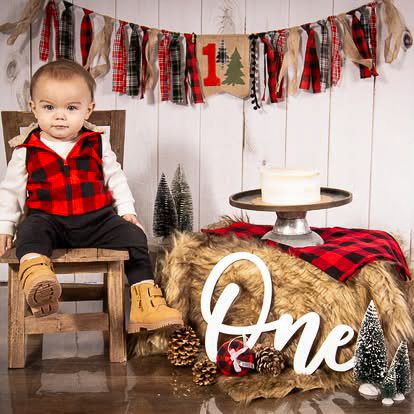 Toddler boy first birthday milestone portrait session with festive background in Springtown, TX