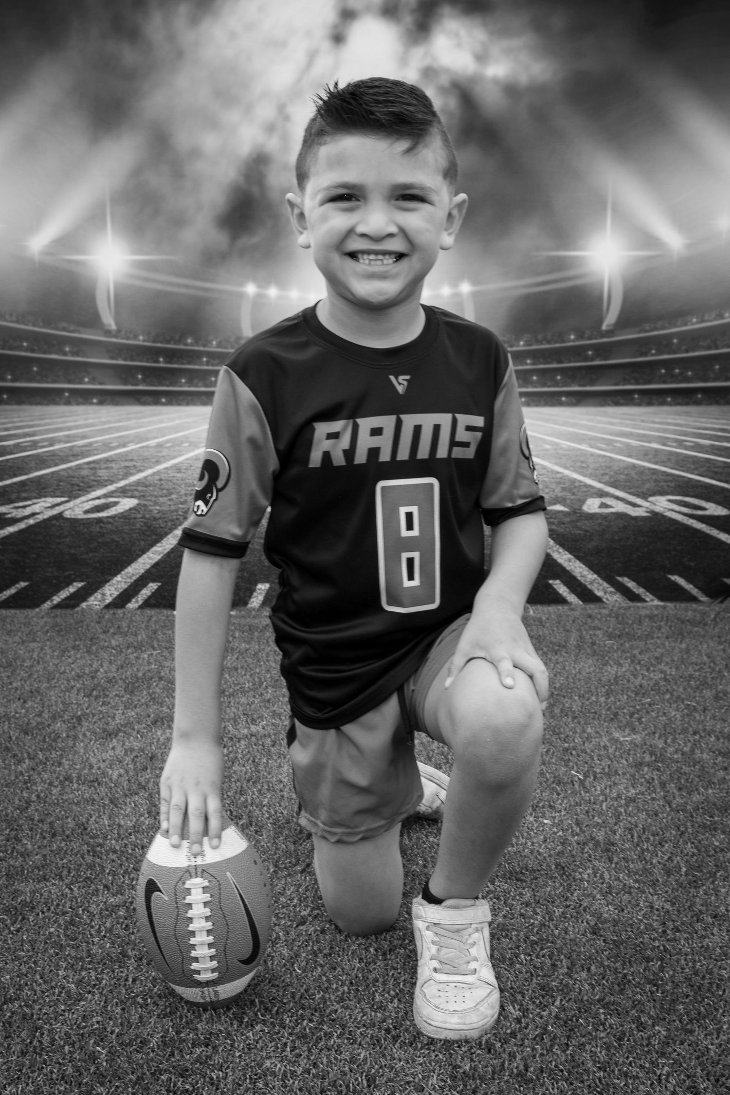 Child portrait in front of a stadium lighting backdrop by Tiny Toes to Tassels Photography in Springtown, TX