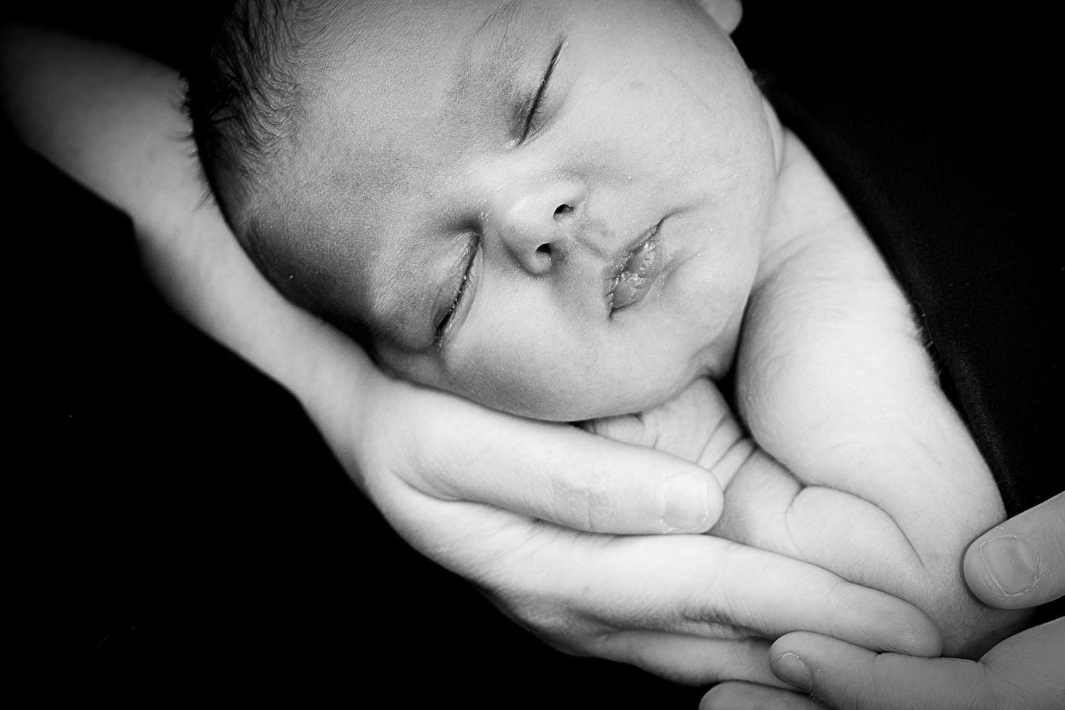 Sleeping newborn baby wrapped in a soft blanket by Tiny Toes to Tassels Photography in Springtown, TX