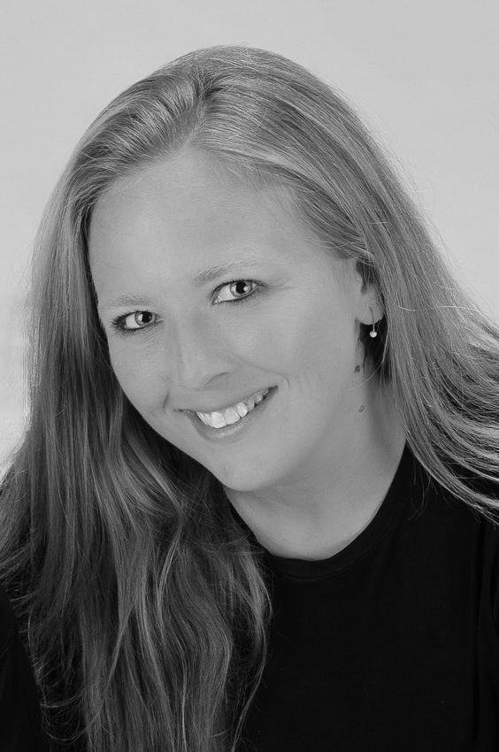 Black and white portrait of a smiling woman by Tiny Toes to Tassels Photography in Springtown, TX