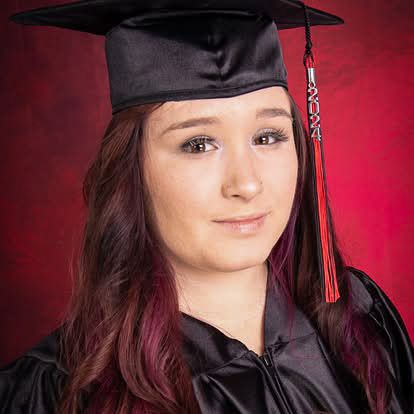 High school senior portrait with graduation cap and gown by Tiny Toes to Tassels Photography in Springtown, TX
