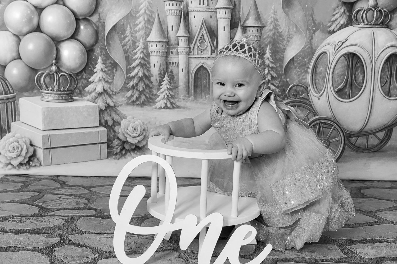 Baby girl celebrating her first birthday with a cake smash and festive backdrop in Springtown, TX