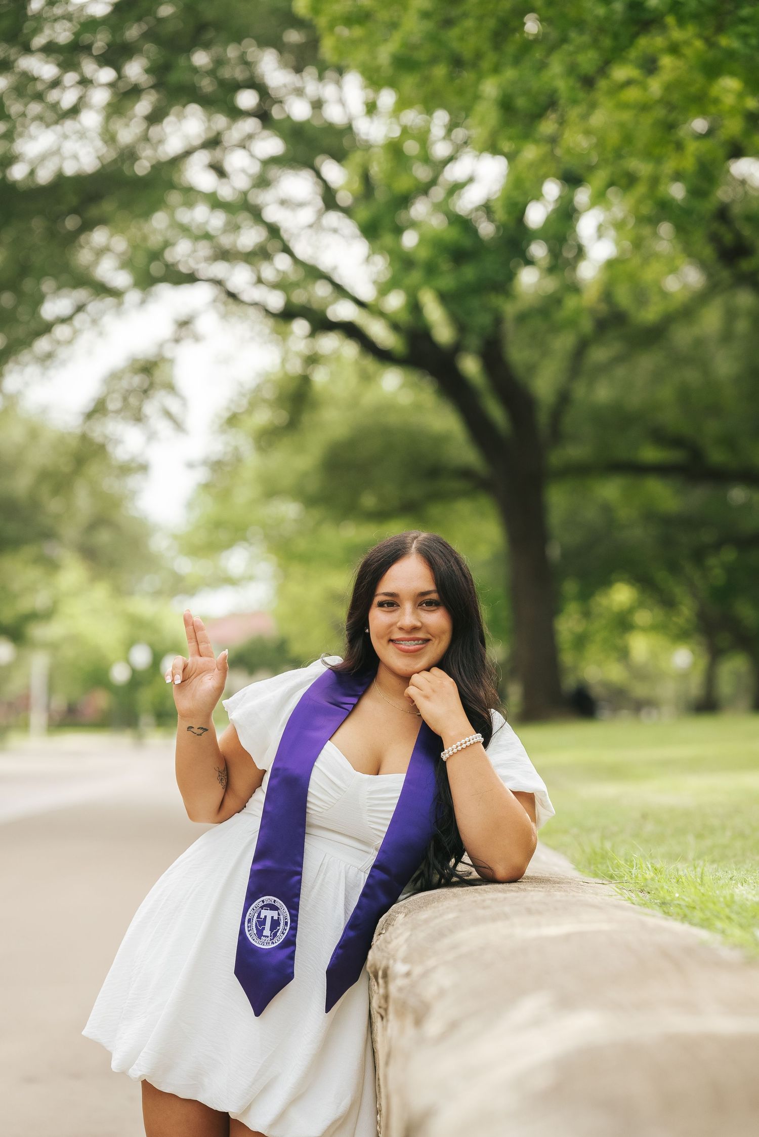 Graduation portrait photography at Tarleton State University in Stephenville, Texas, featuring a graduate on campus.