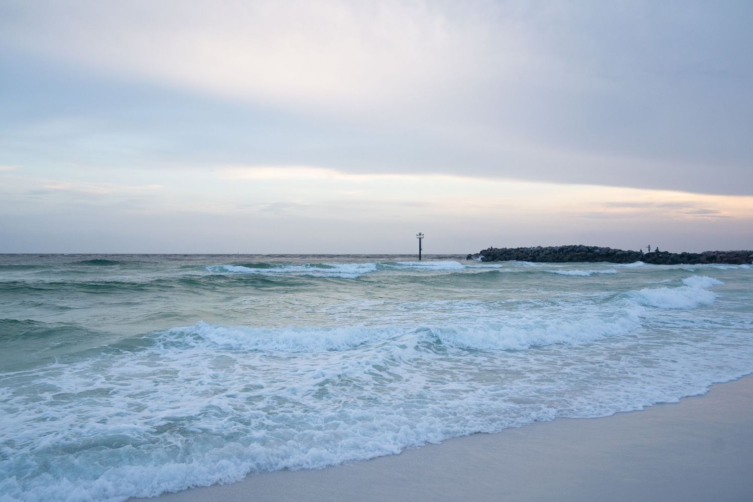 Beach landscape photography at sunset in Destin, Florida, featuring the Gulf Coast shoreline and evening sky.