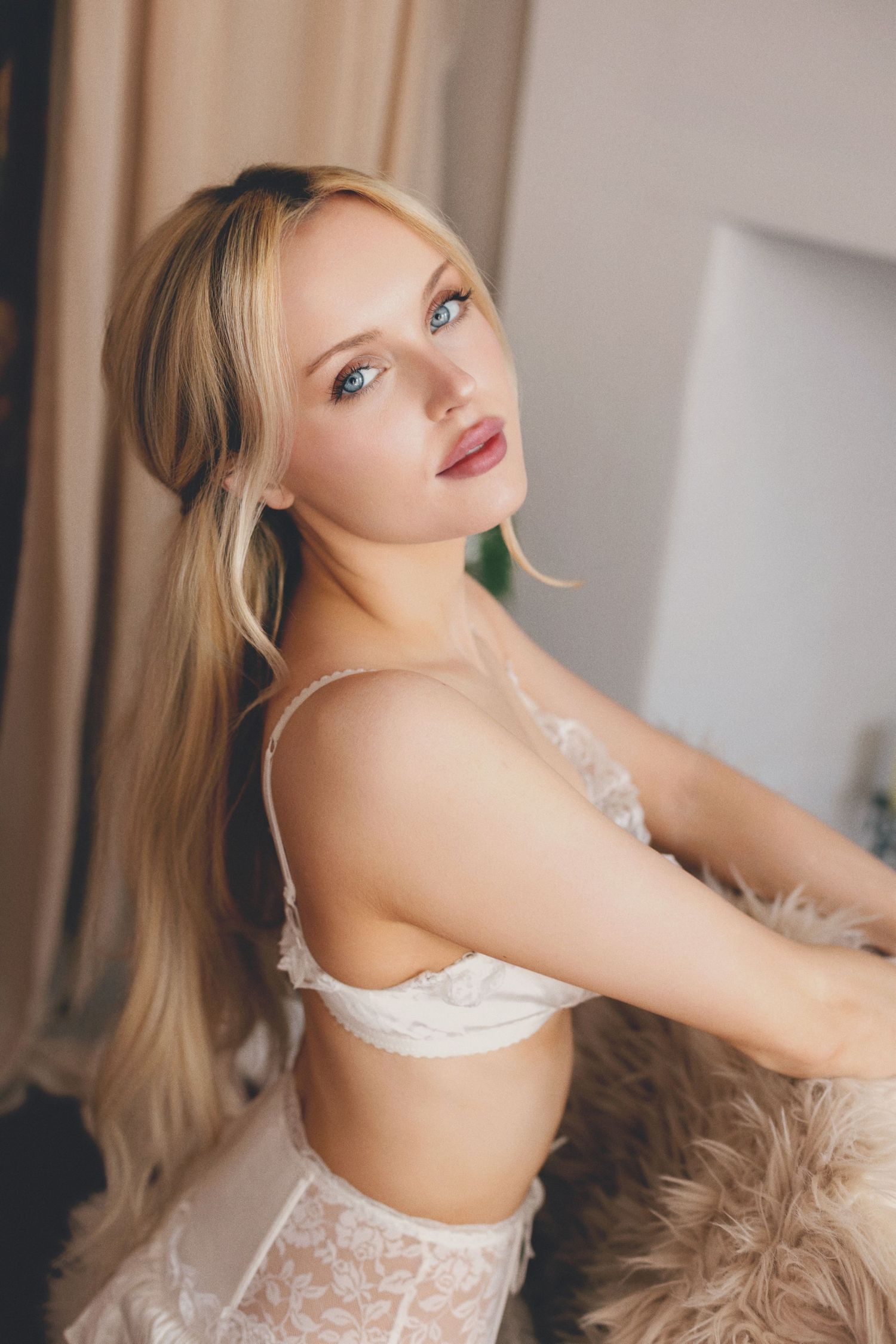A boudoir photo series shows a person in white lingerie posing on a beige chair against a light backdrop.