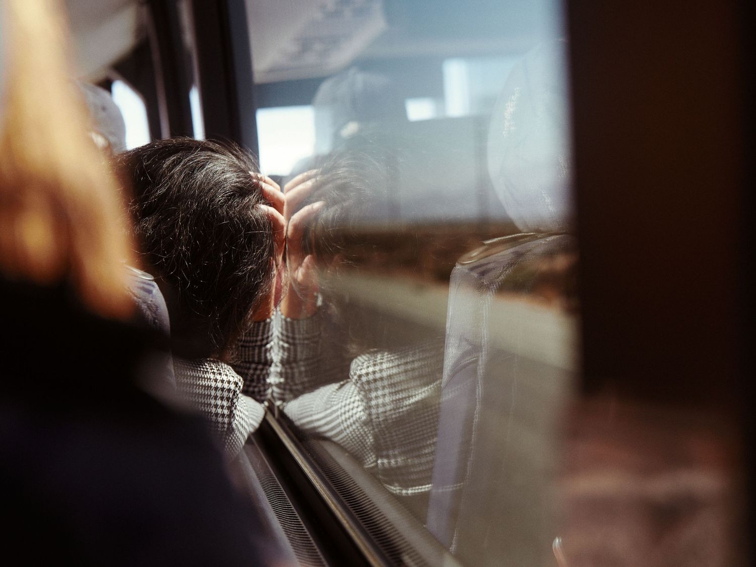 A volunteer looks out the bus window en route to canvass in Maricopa County, Ariz., Oct. 2024. (Afonso Salcedo)