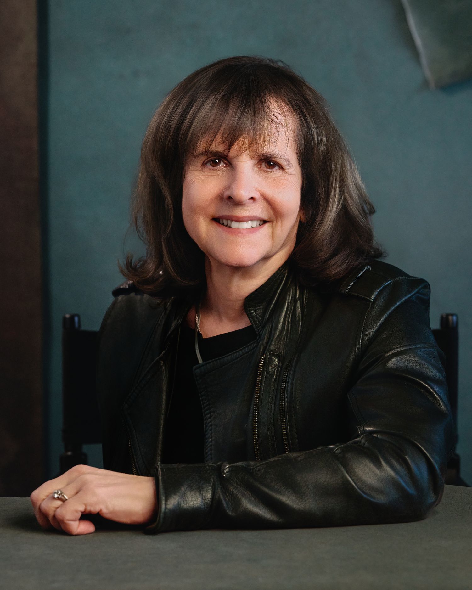 Warm environmental portrait of woman in leather jacket — portrait by Los Angeles photographer Afonso Salcedo
