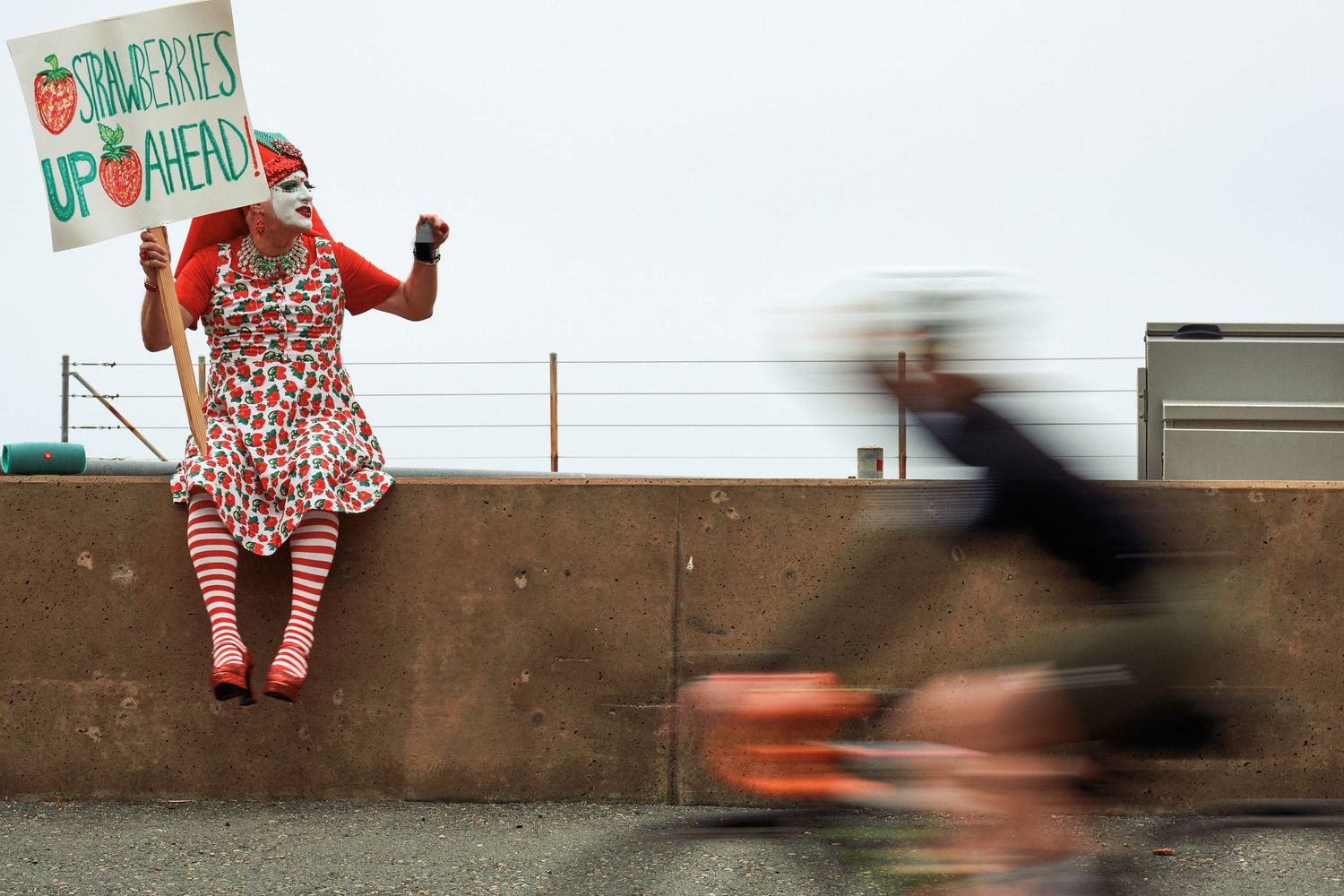 A roadside Sister of Perpetual Indulgence volunteer cheers on a passing rider during AIDS/LifeCycle, June 2025. (Afonso Salcedo)