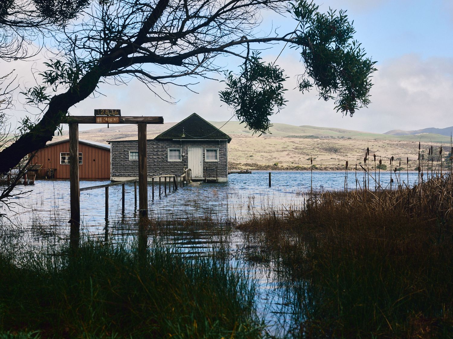 Floodwaters surround a boathouse in Inverness, Calif., Sat., Jan. 3, 2026, during king tides. (Afonso Salcedo)