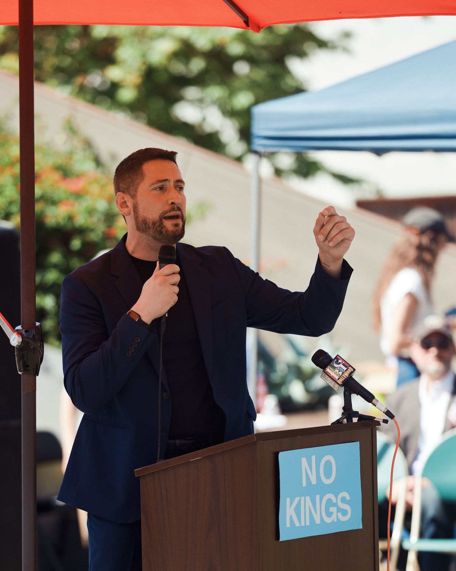Councilmember John Erickson speaks at the No Kings rally, West Hollywood Park, March 28, 2026. (Afonso Salcedo)