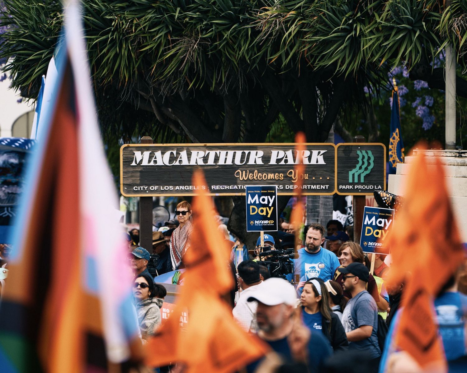 Demonstrators gather at MacArthur Park for the May Day rally in Los Angeles, May 2026, marking 20 years since the 2006 immigration marches.