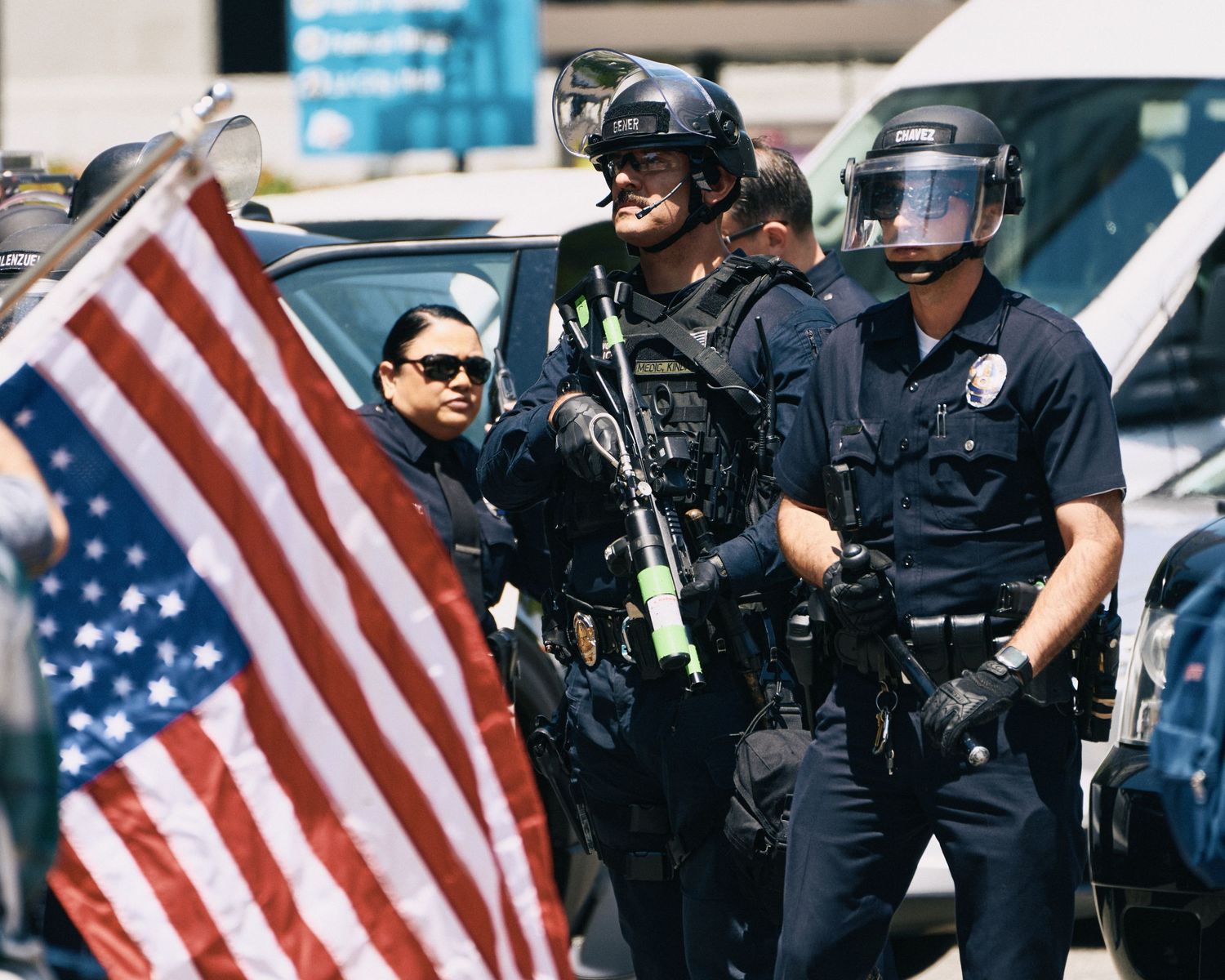 LAPD officers in riot gear with less-lethal weapons stand in formation during the May Day rally near City Hall, Los Angeles, May 1, 2026.