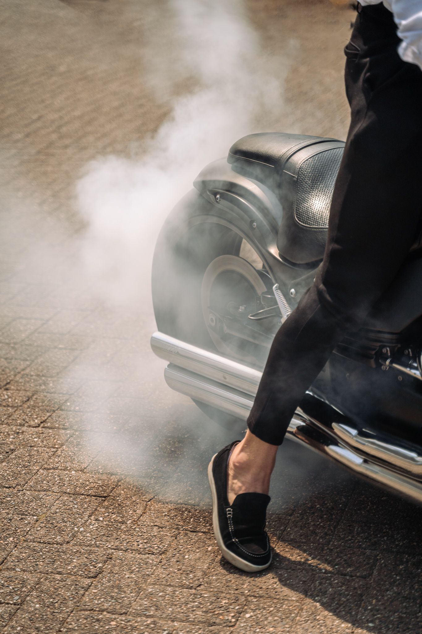 a smoking riving motorbike shot
