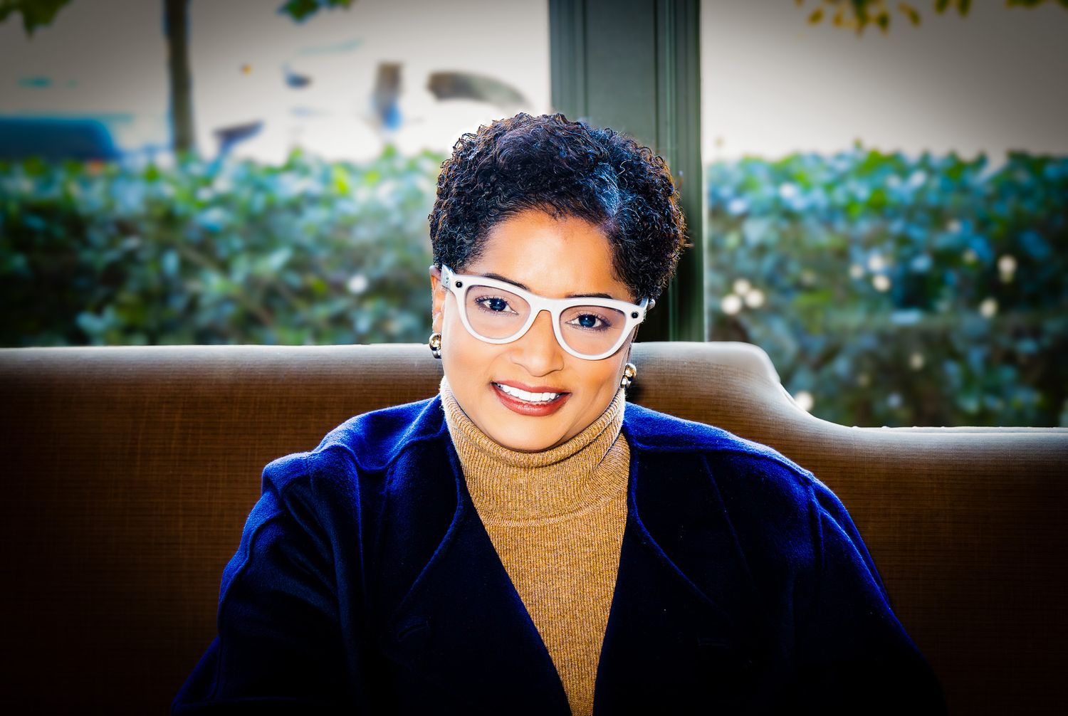 A series of headshots against blurred backgrounds showing someone in a brown turtleneck sweater and clear glasses.