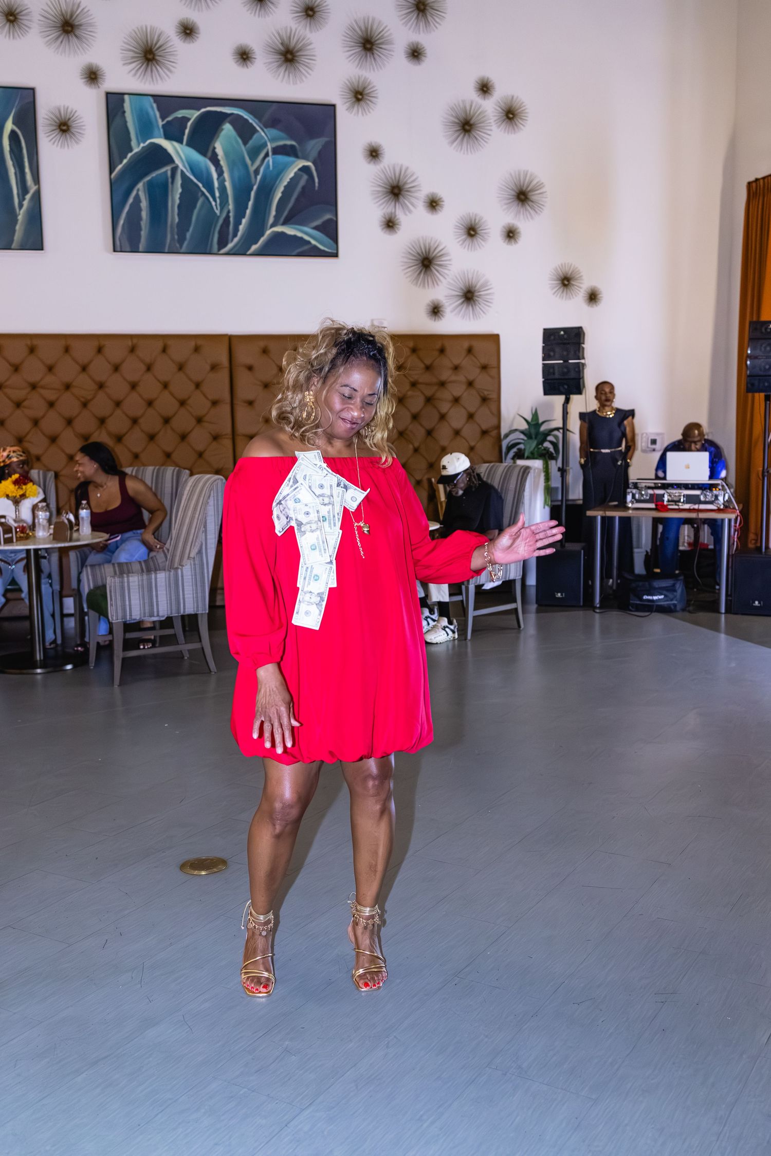 Dance floor with star decorations and wall art in an event space.