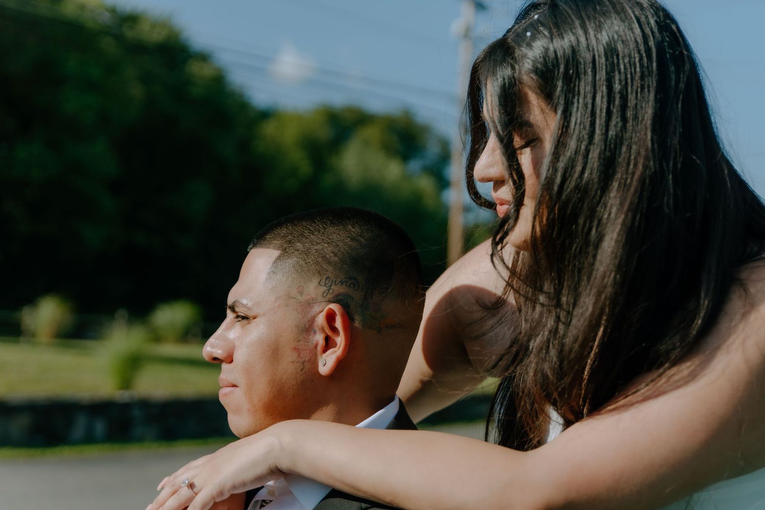A color image of a woman with her arms around a man's shoulders. Shot at The Barn at Twiggys in Middletown, New York.