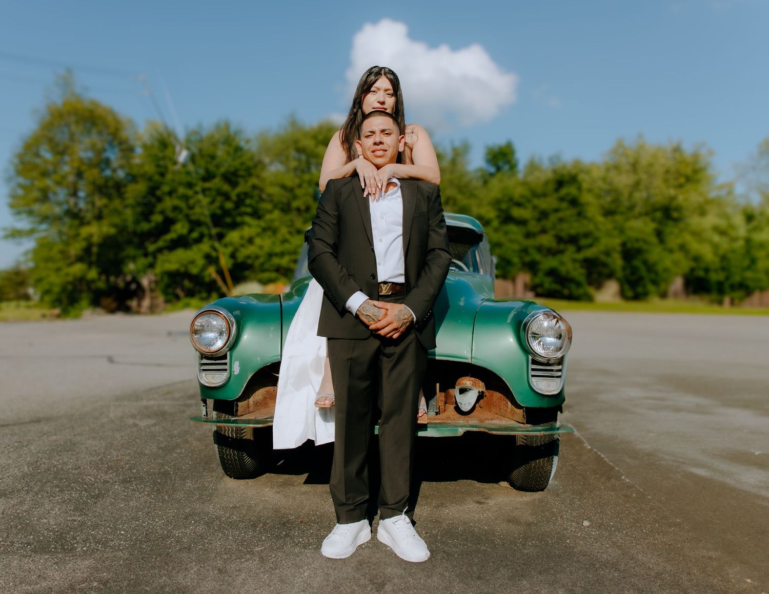 A couple standing in front of a vintage vehicle. Shot at The Barn at Twiggys in Middletown, New York.