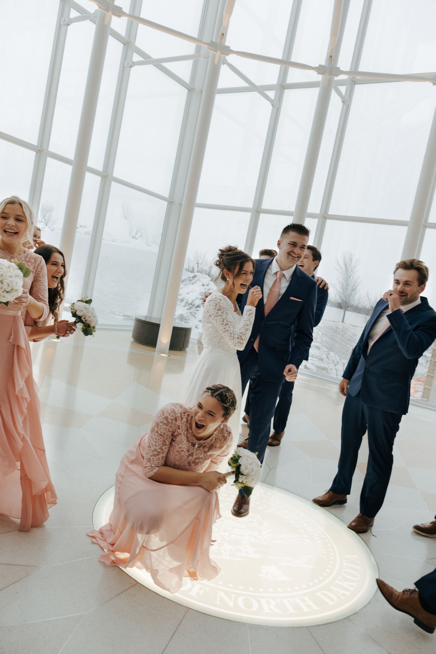 wedding party laughing together in Bismarck