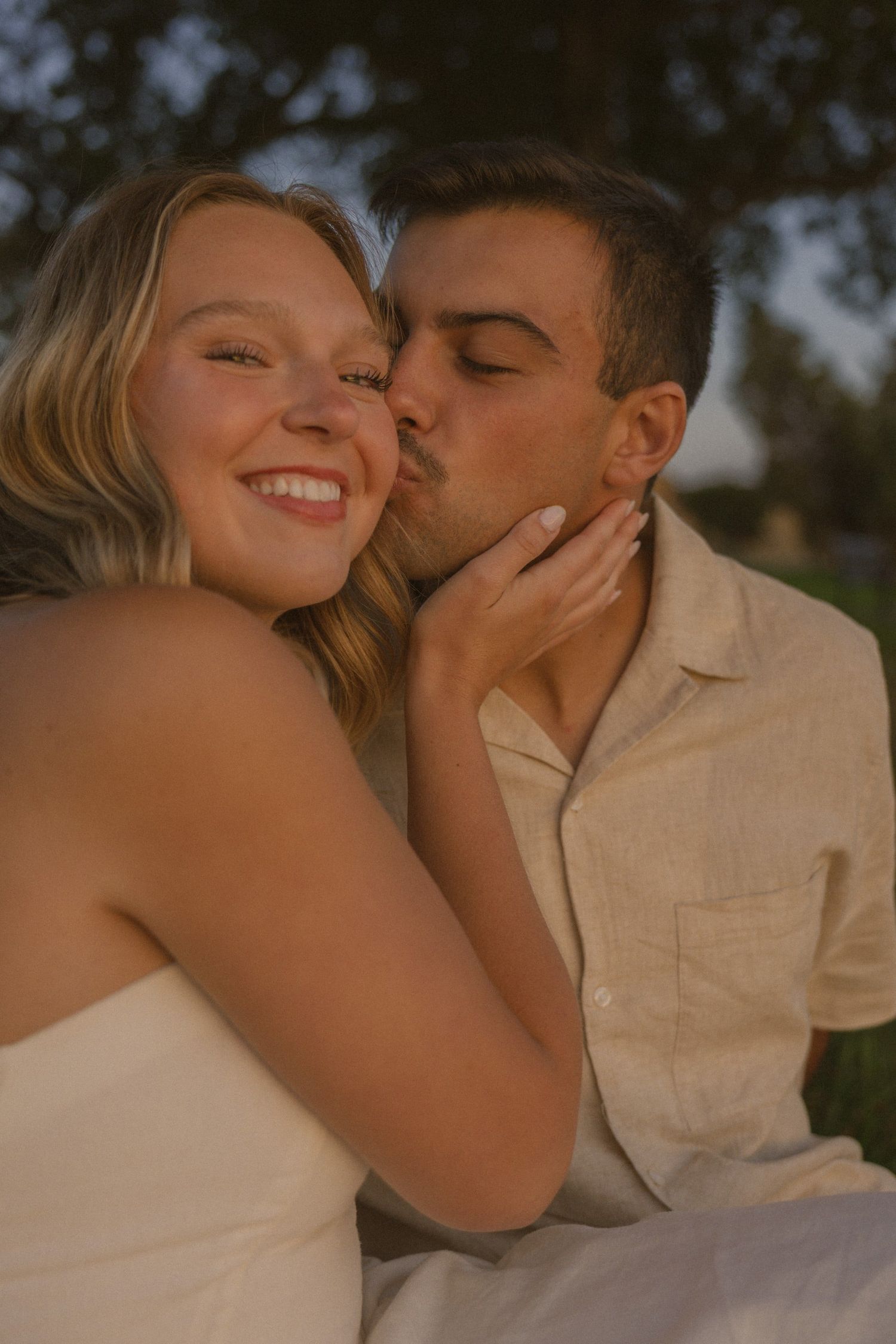 An intimate photo sequence showing a couple sharing affectionate moments during golden hour.