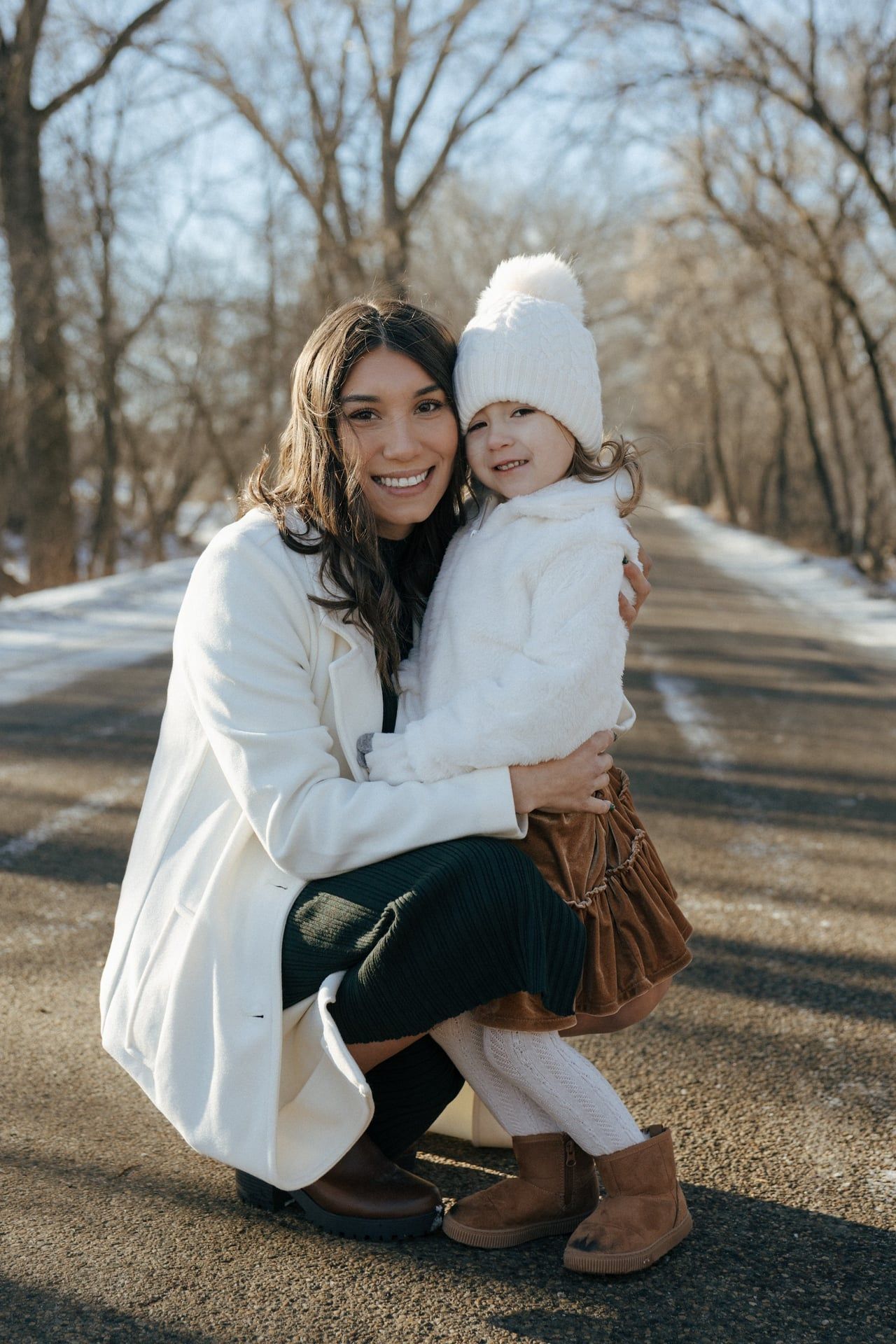 photos of mom and daughter in snowy trees in Bismarck
