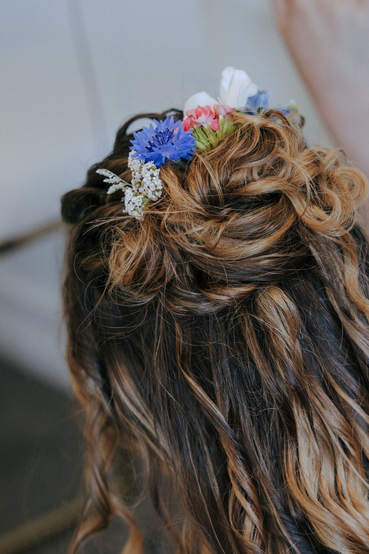 Delicate floral hair accessories adorned with blue and pink blooms.