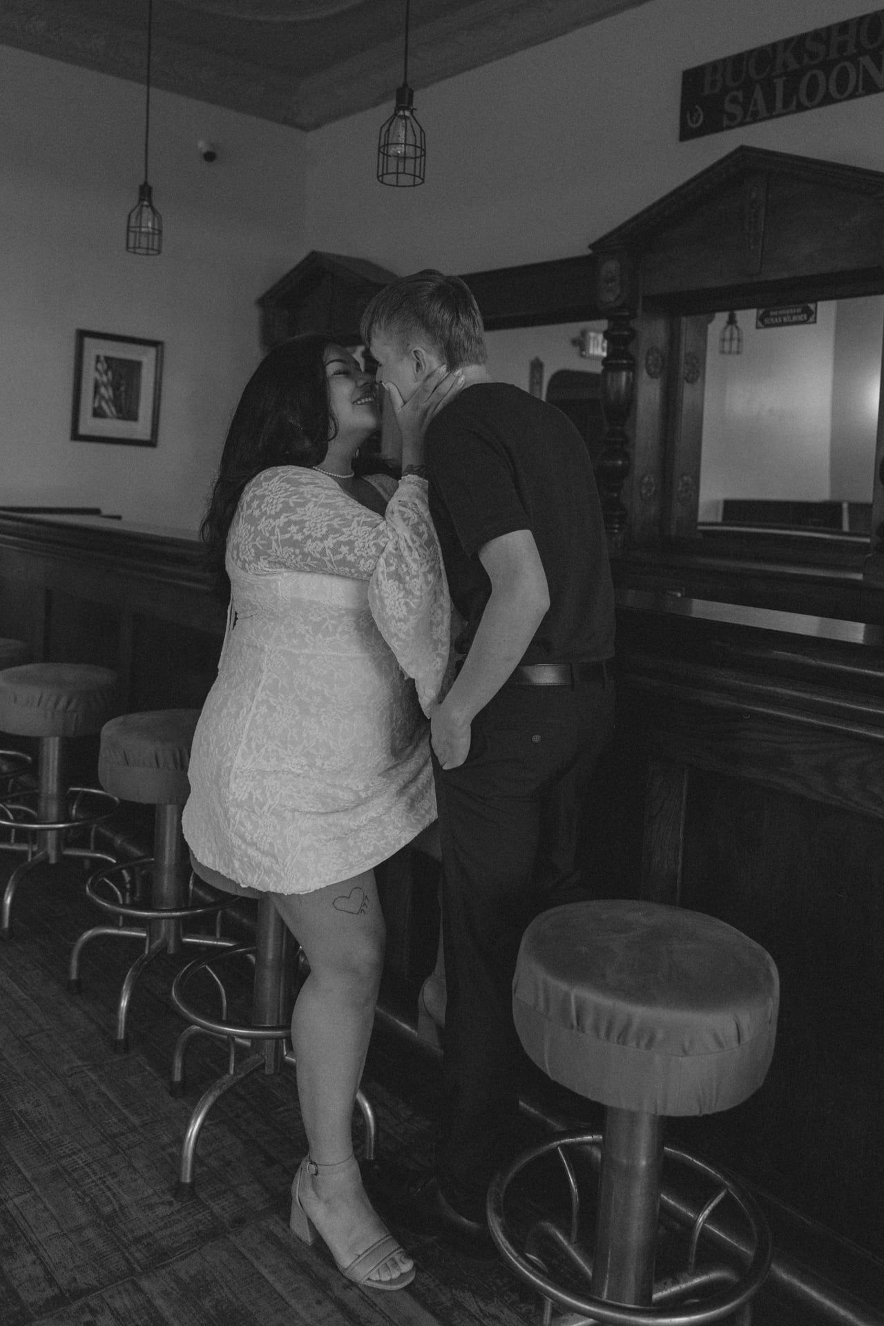 couple kissing in bar