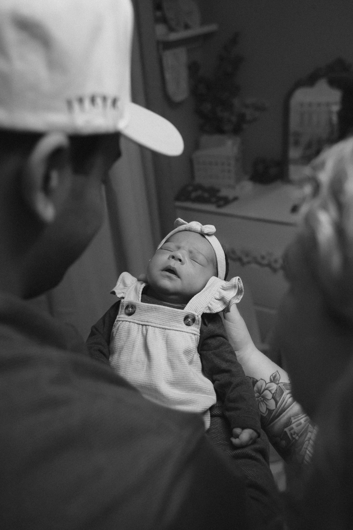 parents looking down at newborn together