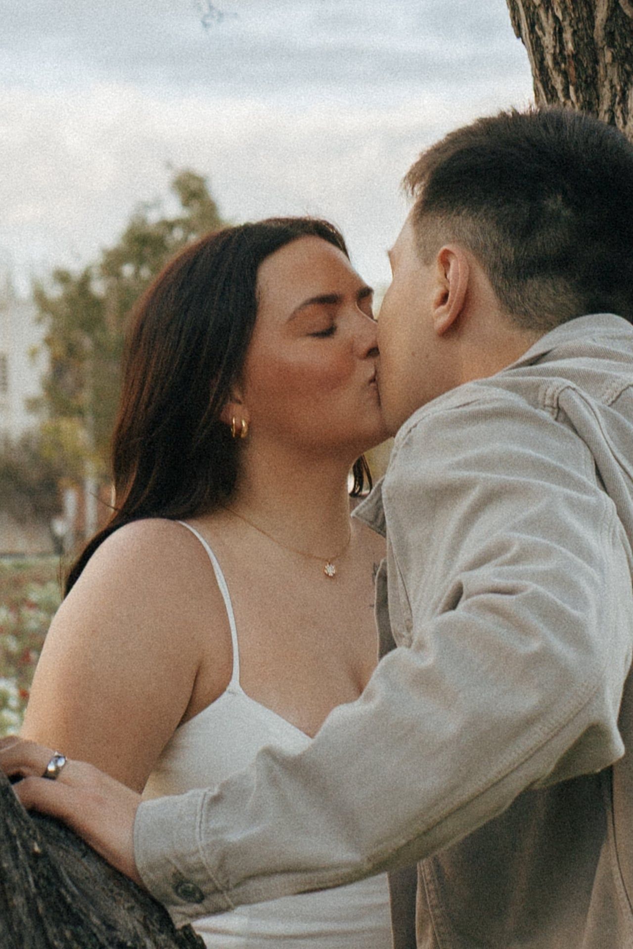 couple kissing for engagement photos