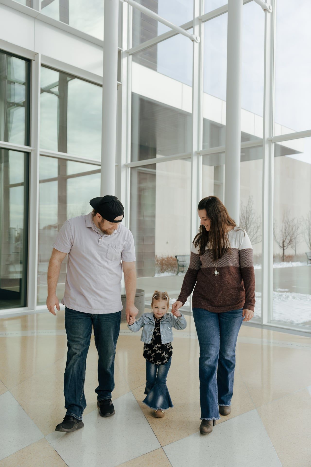 family walking holding hands in Heritage Center in Bismarck North Dakota