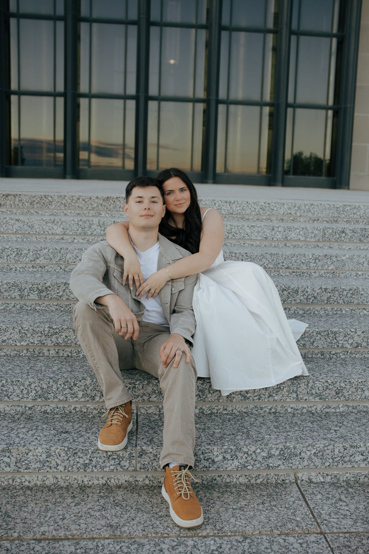 couple hugging for engagement photos in Bismarck