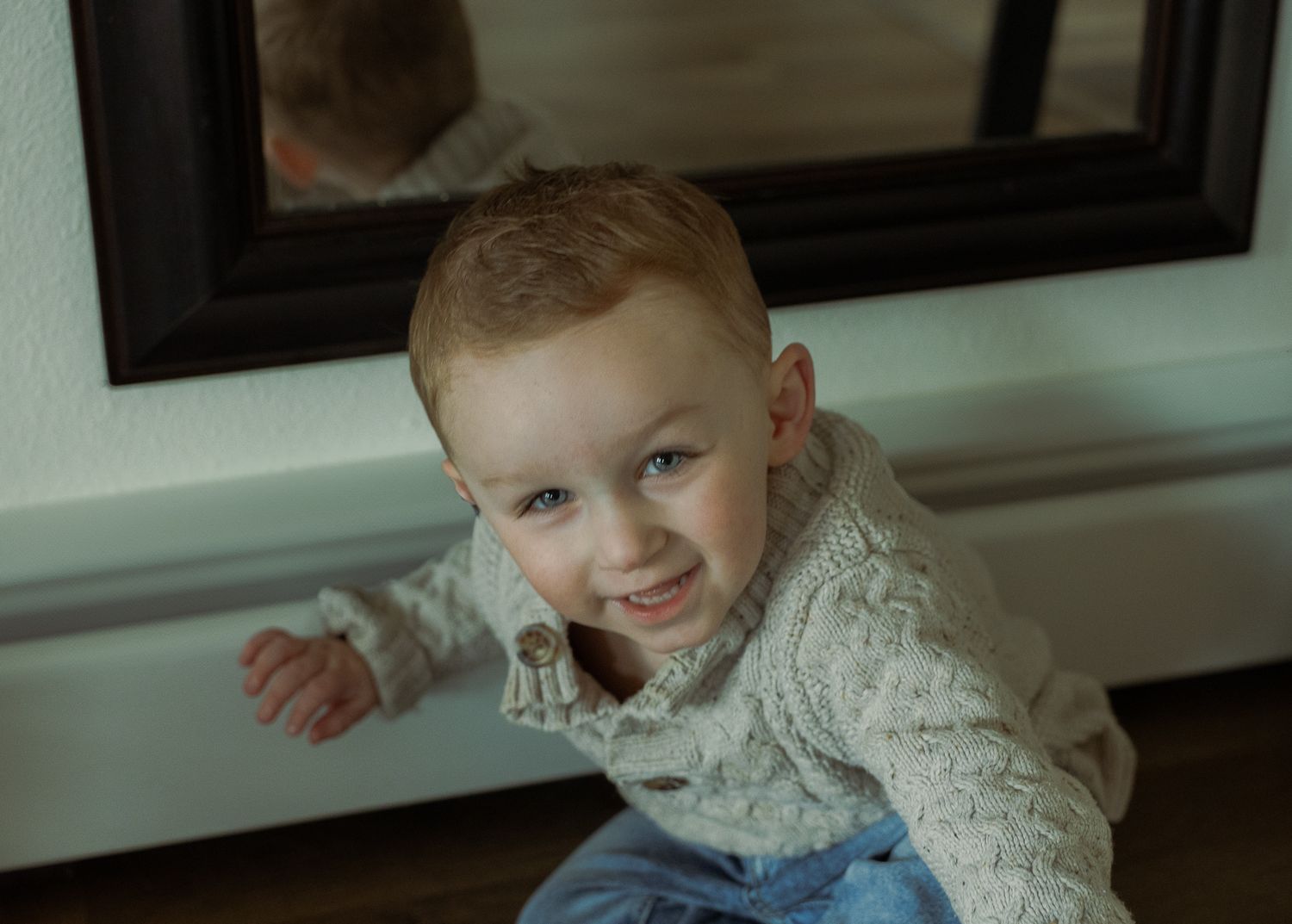 toddler laughing at home for indoor family session